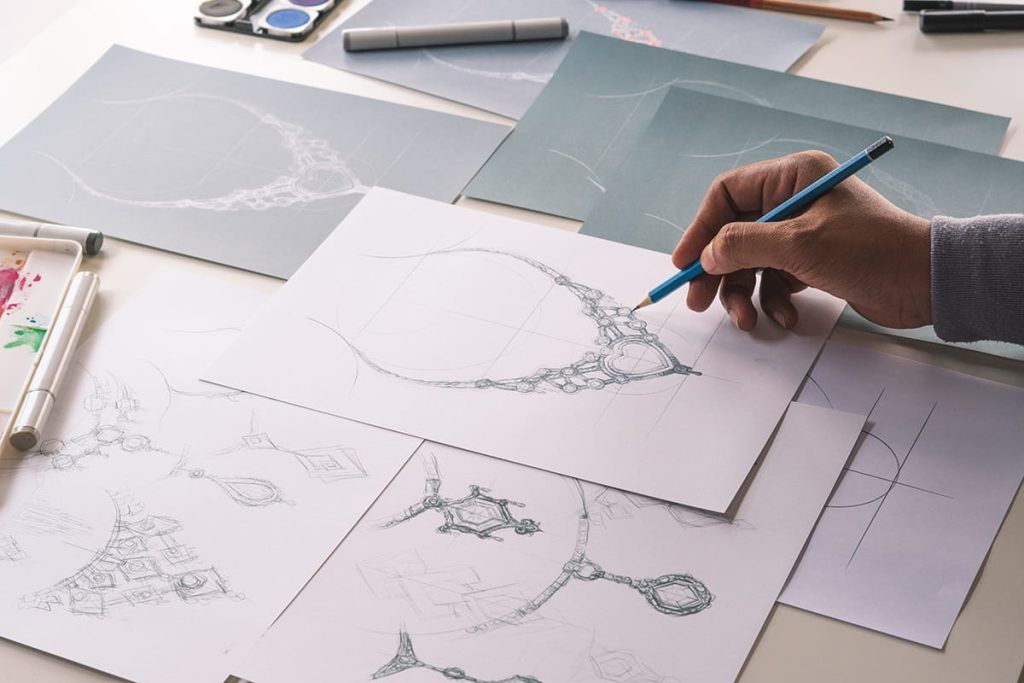 artist sketching a necklace