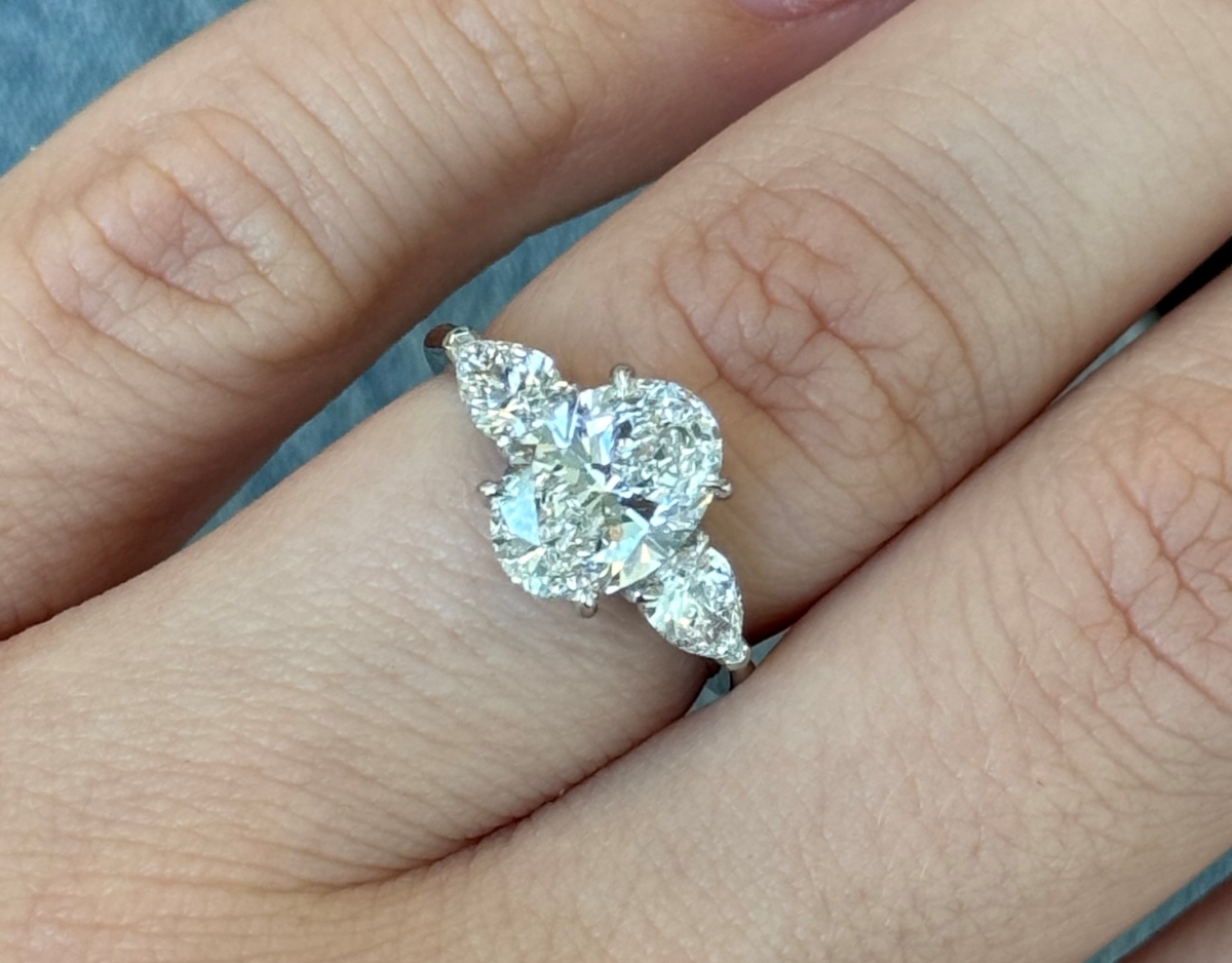 Oval Diamond 3 Stone ring with pear shape side stones